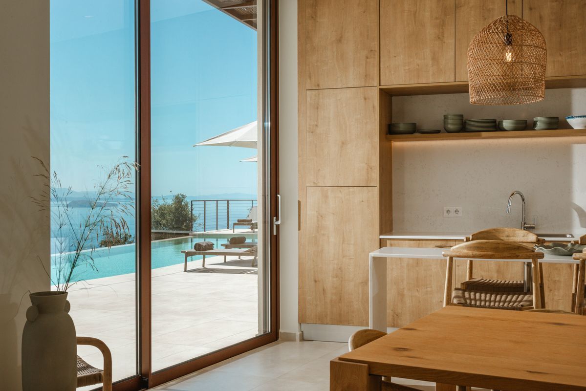 Professional kitchen appliances and breakfast bar at Villa Mulberry