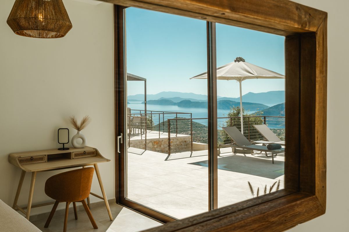 Bedroom with pool views at Villa Mulberry Sivota